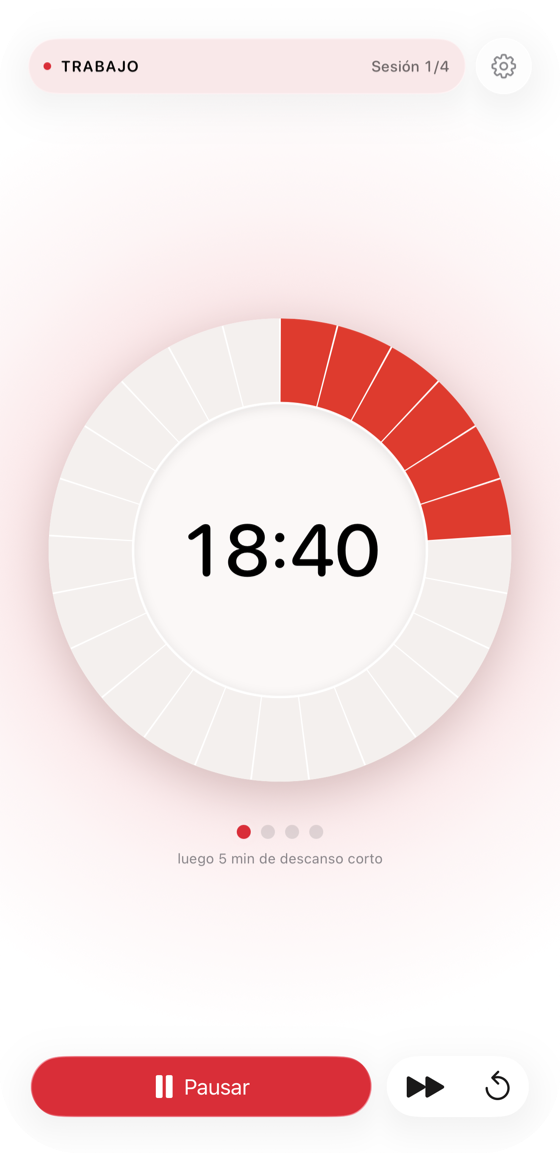 El temporizador Pomodoro Tomatino en un iPhone: la esfera al estilo Time Timer llena la pantalla y descuenta una sesión, con el ciclo y los controles debajo